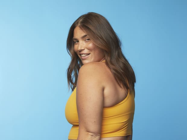 Photo of woman in front of blue background