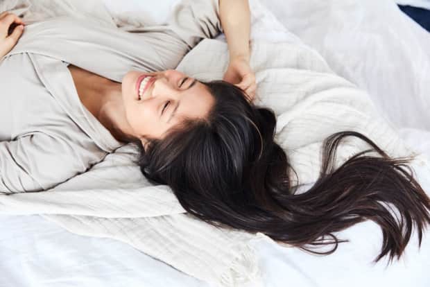 Photo of woman lying on bed
