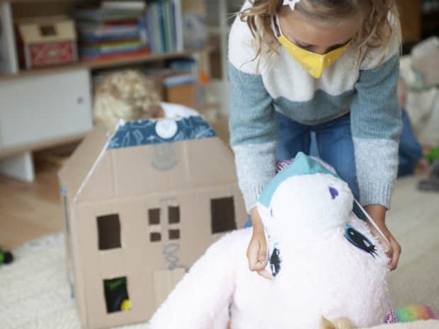 Photo of child holding stuffed animal