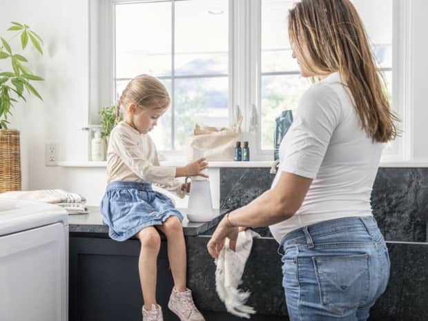 Woman and child doing laundry