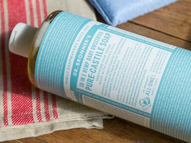 Image of Dr. Bronner Castile Soap Unscented blue bottle lying on its side