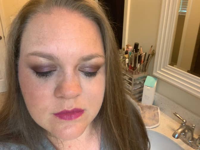 Before photo of woman with makeup on before removing it.