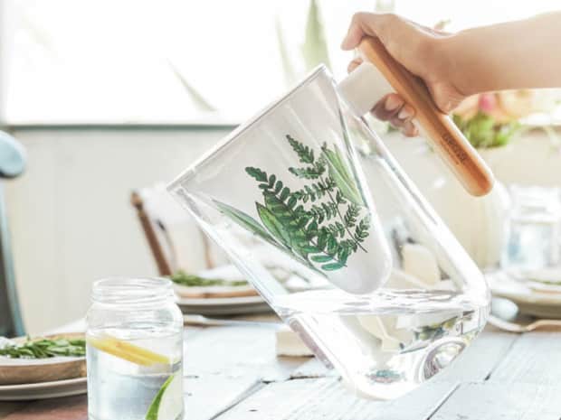 Photo of flavoured water being poured into mason jar