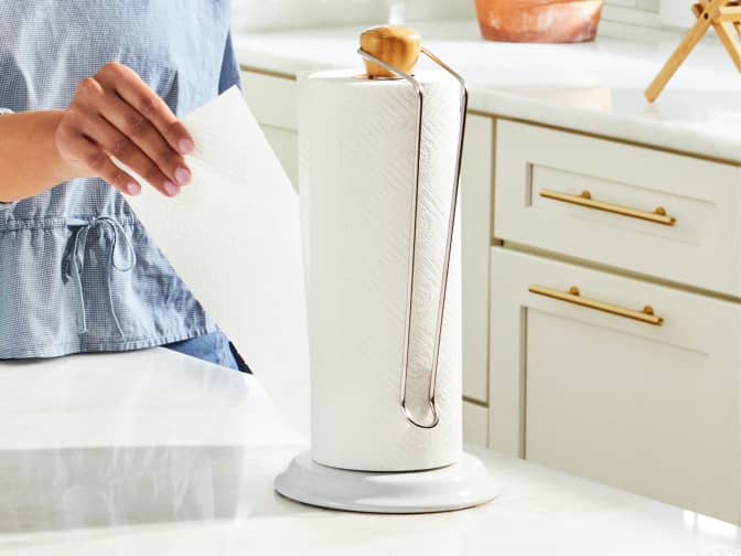 Woman pulling off a sheet of paper towel