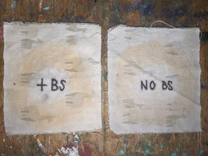 Image of 2 cloths slightly stained with sriracha after washing