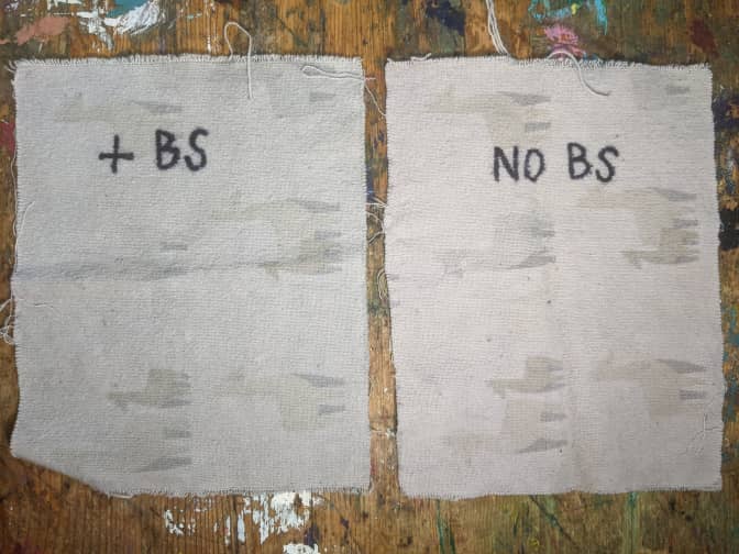 Image of 2 pieces of cloth after being washed that were previously stained with red wine