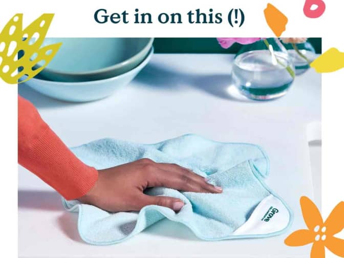 Image of person cleaning counter with Grove Co. blue microfiber cloth