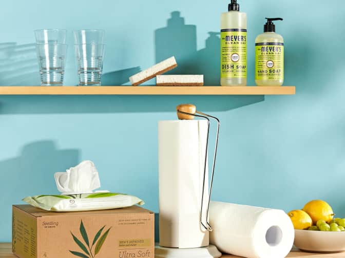 Image of blue painted wall with shelves and products on shelves and counter below