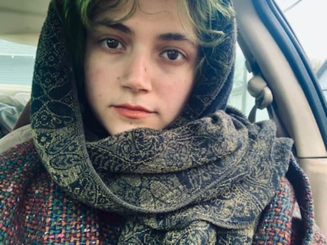 Photo of woman wearing scarf over head