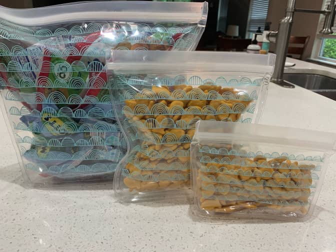 Photo of three Grove reusable food storage bags with snacks 