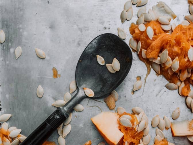 Photo of spoon with pumpkin innards