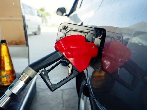 Image of a gas pump in a car.