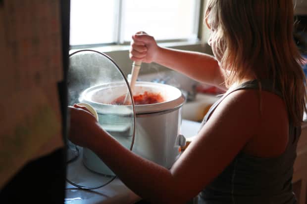 Image of someone stirring in an Instant Pot. 