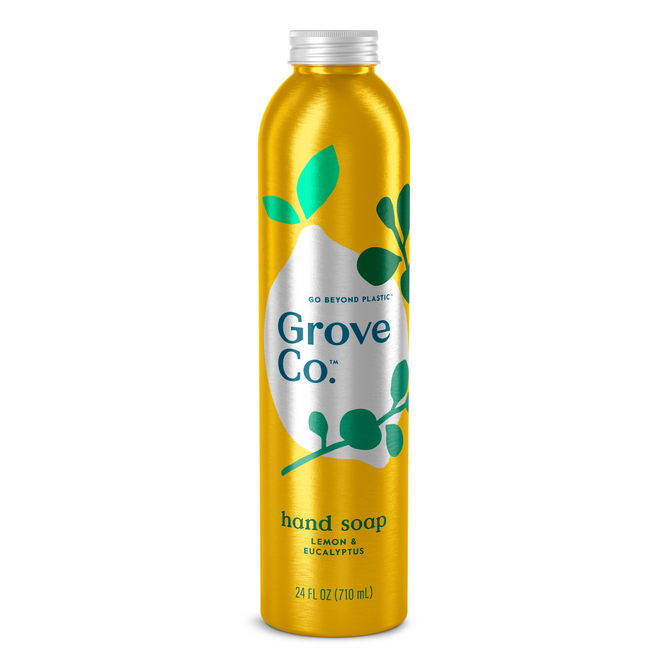 A 24 fl oz tall yellow Grove Co. metal bottle of hydrating hand soap features a silver cap, Go Beyond Plastic, green leaf design, and labeled Lemon & Eucalyptus with plant-based ingredients.