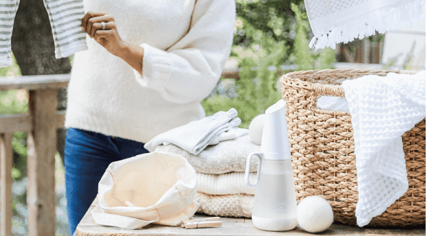 Image of a women folding laundry 